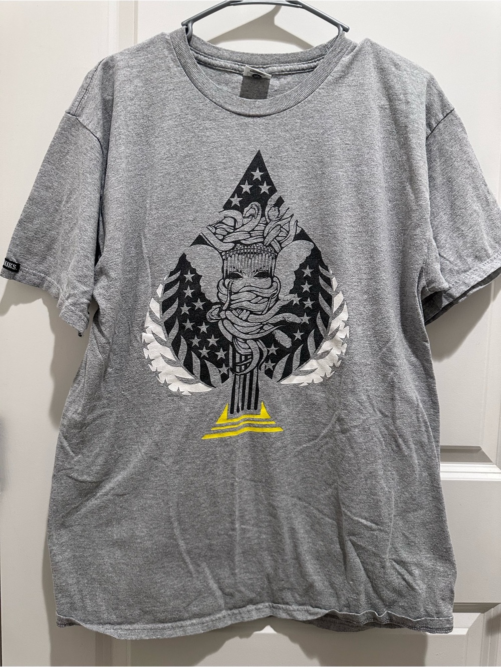 Crooks & Castles Gray Short Sleeve Tee with Ace Spade Graphic and Yellow Accent